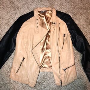 Tan and black leather jacket